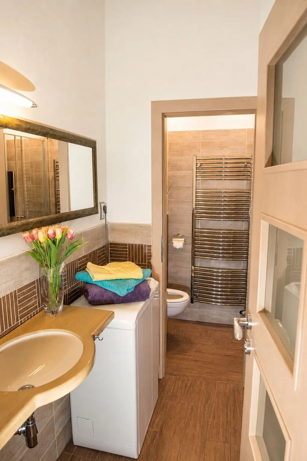 Bathroom with washing machine in family apartment in Košice