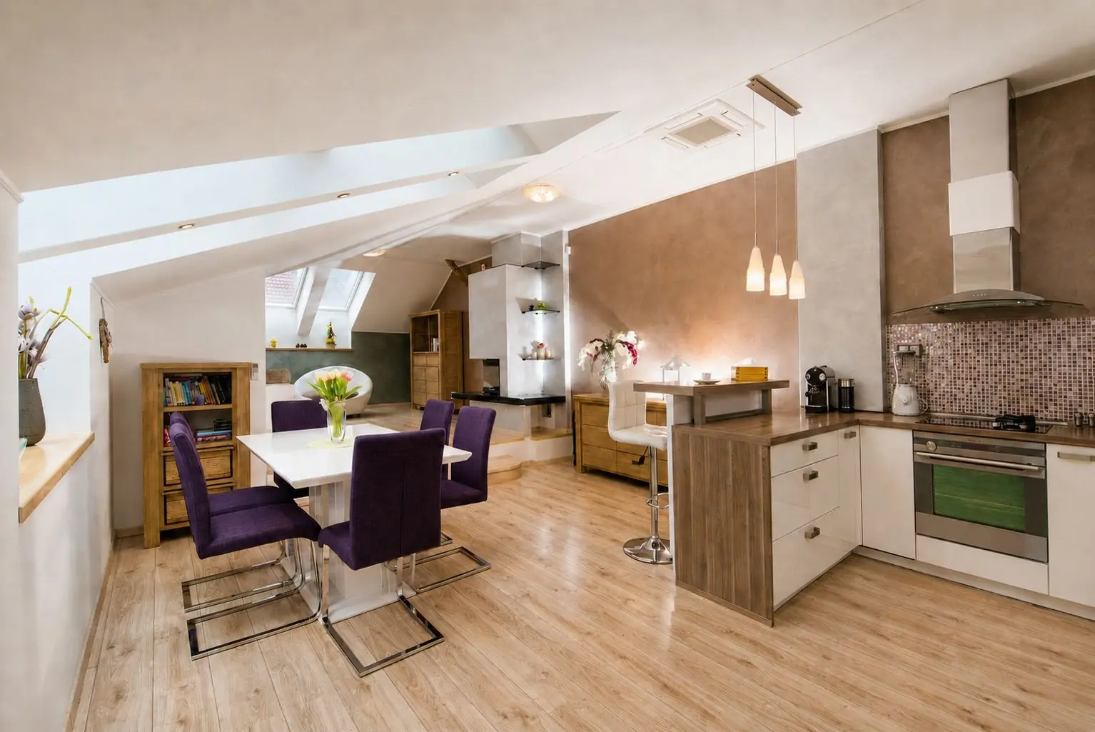 Bright open-plan kitchen and dining area for family stays in Košice apartment