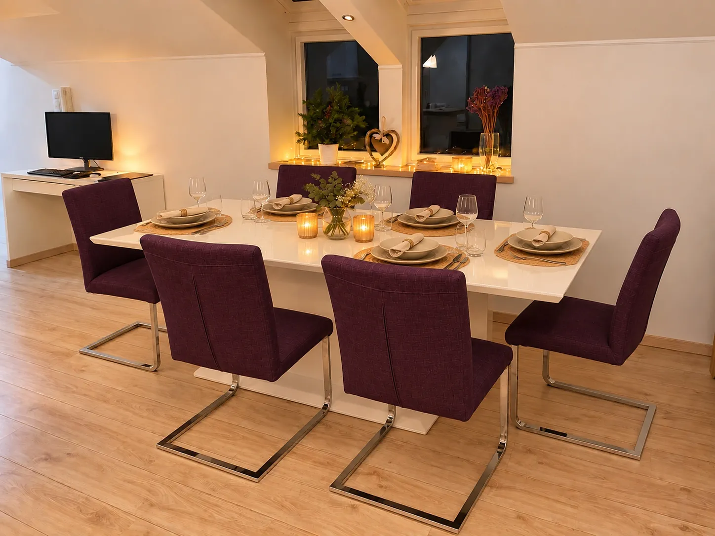 Dining table with six chairs, set for dinner