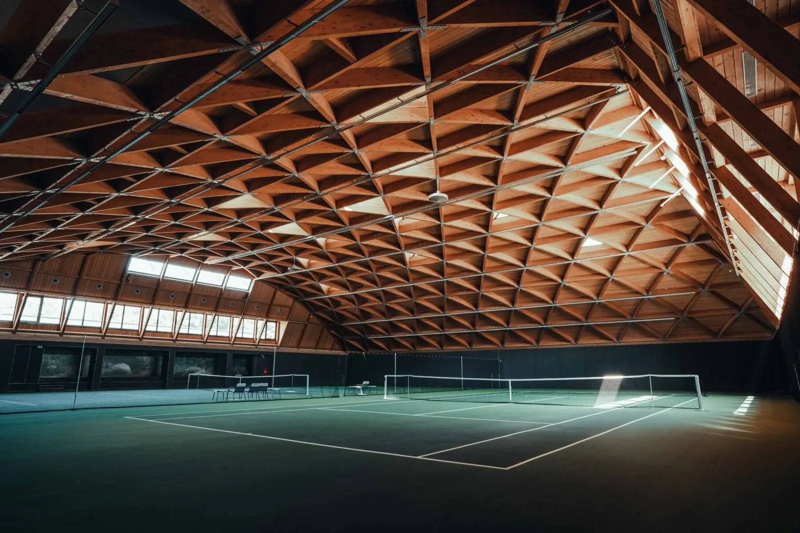 Indoor tennis court at Villa Sandy City Park Resort with professional GreenSet surface